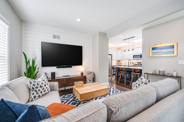 101 Draper St Unit 3, Boston, MA 02122 - living room featuring wood finished floors, recessed lighting, and wood walls