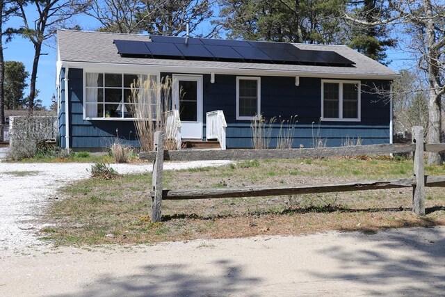 25 Day Rd, Wellfleet, MA 02667 - bungalow with roof mounted solar panels and a shingled roof