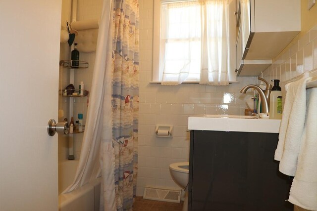 25 Day Rd, Wellfleet, MA 02667 - full bath with plenty of natural light, vanity, tile walls, toilet, and visible vents