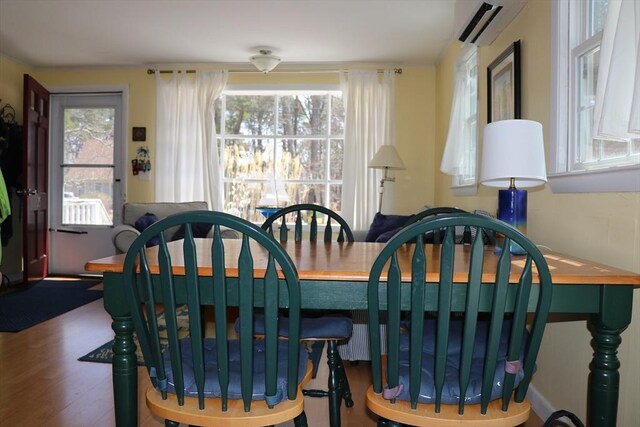 25 Day Rd, Wellfleet, MA 02667 - dining area with wood finished floors, a wall mounted AC, and plenty of natural light