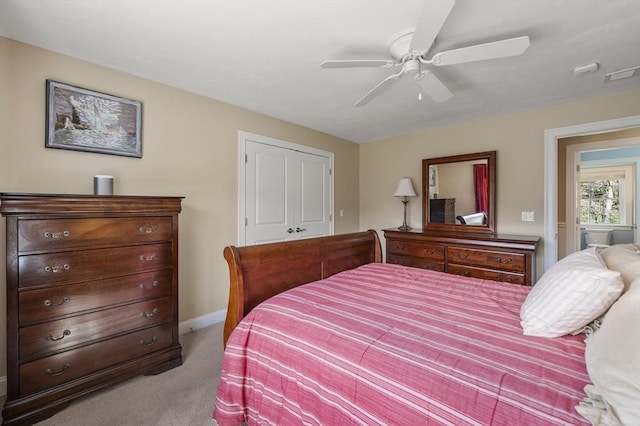 carpeted bedroom with a ceiling fan, visible vents, a closet, and baseboards