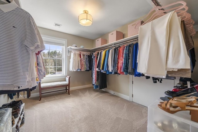 spacious closet with visible vents and carpet