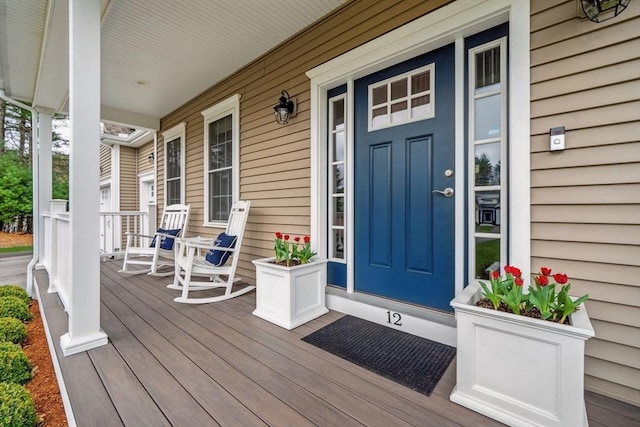 property entrance featuring covered porch