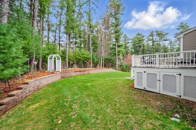 view of yard featuring a wooden deck