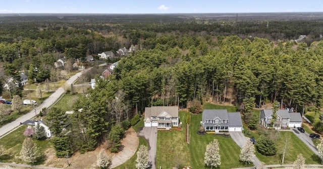 drone / aerial view featuring a view of trees