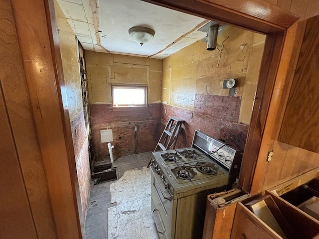 kitchen with brown cabinets and range with gas stovetop