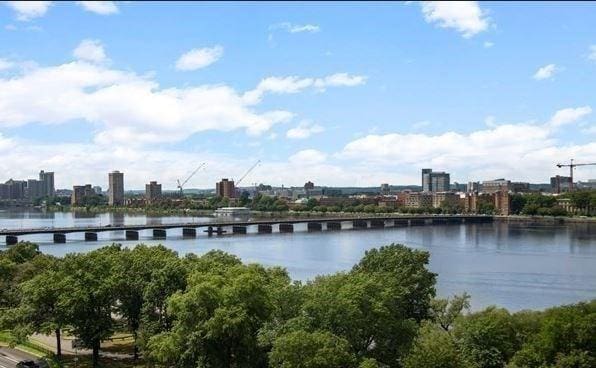 water view featuring a notable bridge and nearby urban area