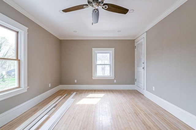 unfurnished room featuring baseboards, a ceiling fan, light wood-style flooring, and plenty of natural light