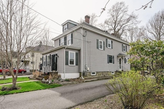 view of home's exterior with a chimney