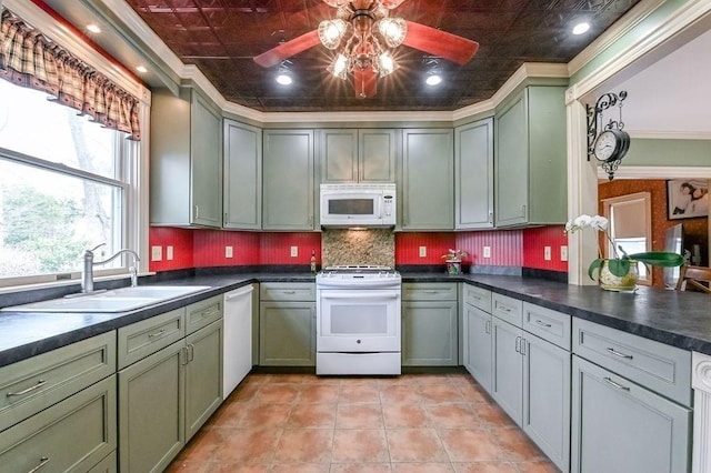 kitchen with ceiling fan, white appliances, green cabinets, and a sink