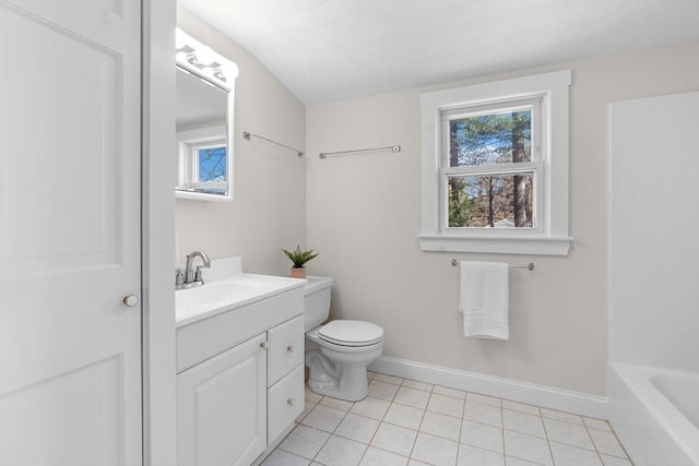 full bathroom featuring baseboards, toilet, vanity, and tile patterned flooring