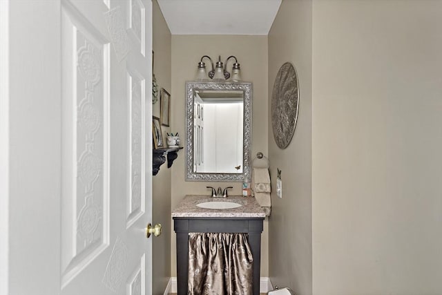 half bathroom with vanity