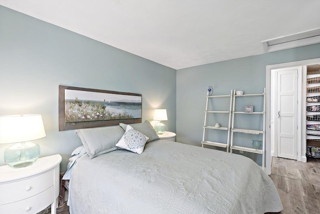 bedroom with wood finished floors