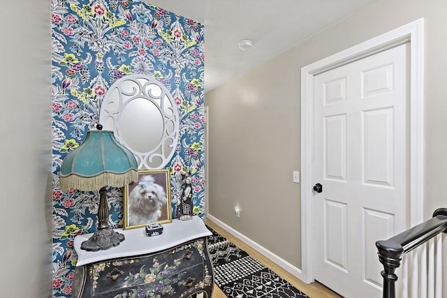 interior space with baseboards and wood finished floors