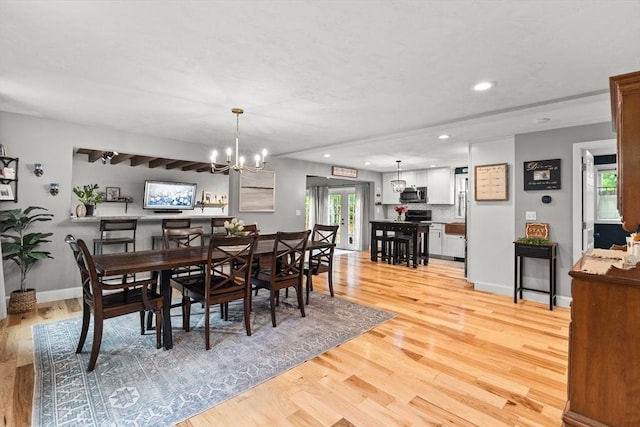 101 Titicut Rd, Raynham, MA 02767 - dining space featuring light wood-type flooring, recessed lighting, baseboards, and a chandelier