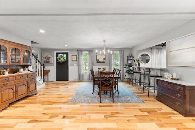 101 Titicut Rd, Raynham, MA 02767 - dining room featuring stairway, light wood-style floors, a chandelier, and recessed lighting