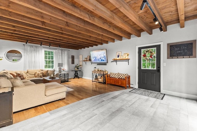 101 Titicut Rd, Raynham, MA 02767 - living area with wooden ceiling with exposed beams, baseboards, wood finished floors, and a baseboard heating unit