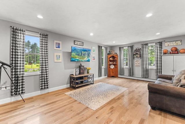 101 Titicut Rd, Raynham, MA 02767 - living room with wood finished floors, recessed lighting, and baseboards