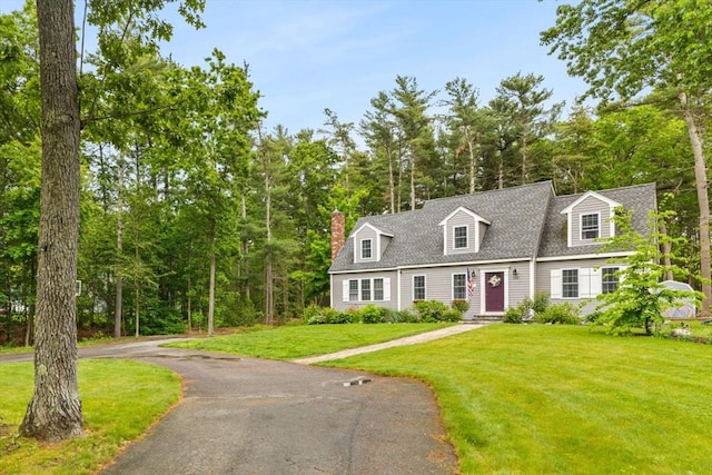 101 Titicut Rd, Raynham, MA 02767 - new england style home with a front yard, roof with shingles, and a chimney