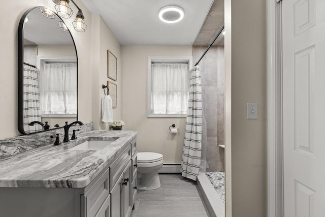 101 Titicut Rd, Raynham, MA 02767 - bathroom featuring toilet, vanity, a baseboard radiator, and a tile shower