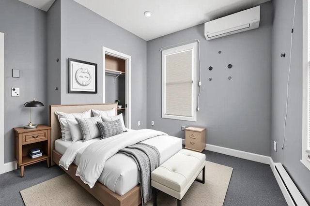 5 Sutton St Unit 3B, Boston, MA 02126 - carpeted bedroom featuring a baseboard heating unit, a wall unit AC, baseboards, a closet, and a spacious closet