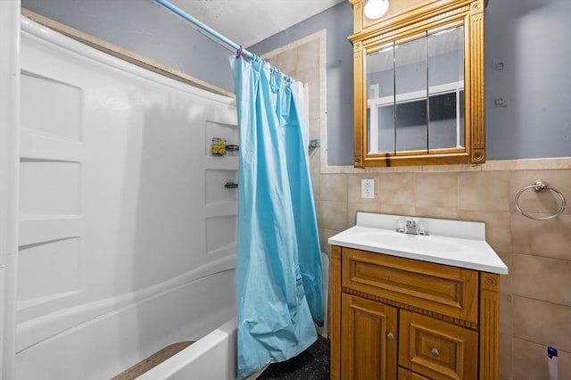 5 Sutton St Unit 3B, Boston, MA 02126 - bathroom featuring tile walls, vanity, and shower / bath combo
