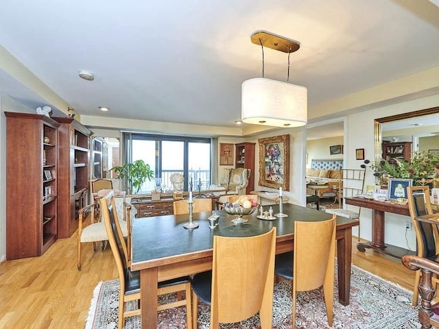 dining area with light wood-type flooring