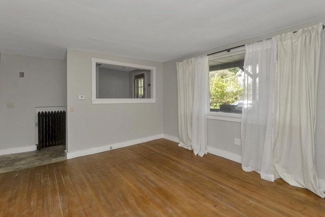 82 Grove St, North Brookfield, MA 01535 - empty room featuring radiator heating unit, hardwood / wood-style floors, and baseboards