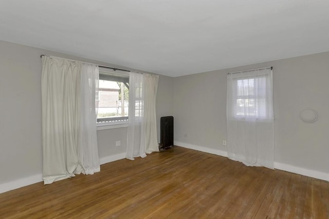 82 Grove St, North Brookfield, MA 01535 - empty room with wood finished floors and baseboards