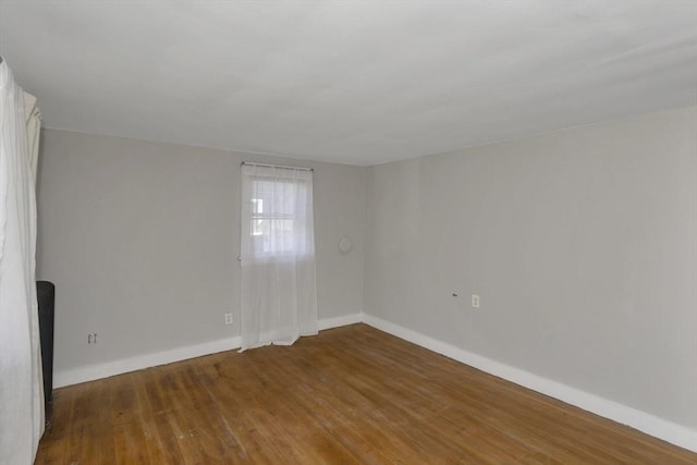 82 Grove St, North Brookfield, MA 01535 - spare room with baseboards and wood finished floors