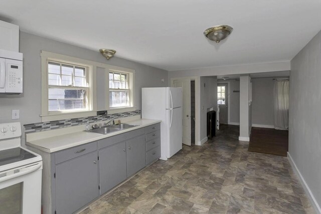 82 Grove St, North Brookfield, MA 01535 - kitchen featuring white appliances, a sink, gray cabinets, and stone finish flooring