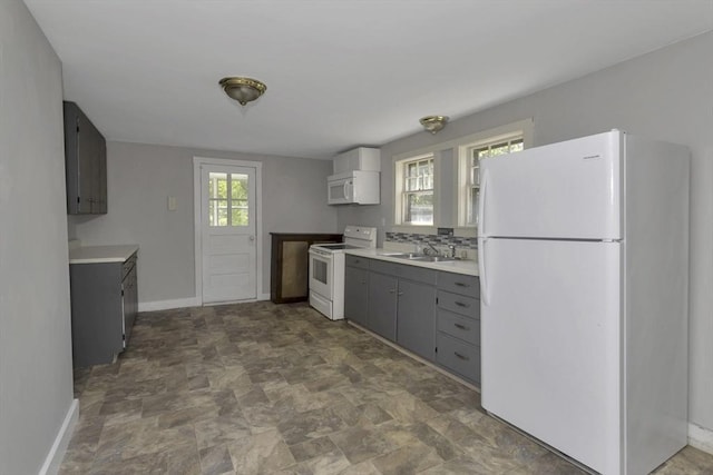 82 Grove St, North Brookfield, MA 01535 - kitchen featuring white appliances, a sink, gray cabinets, stone finish flooring, and baseboards