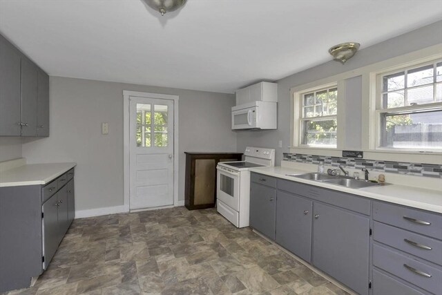 82 Grove St, North Brookfield, MA 01535 - kitchen featuring white appliances, a sink, gray cabinets, stone finish floors, and baseboards