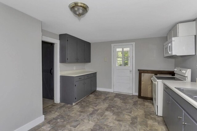 82 Grove St, North Brookfield, MA 01535 - laundry area featuring baseboards and stone finish flooring