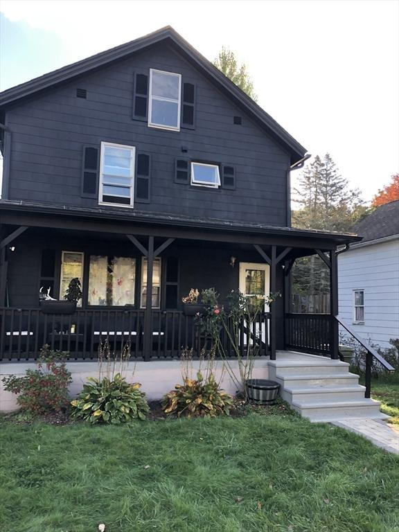 82 Grove St, North Brookfield, MA 01535 - back of property with a porch and a lawn