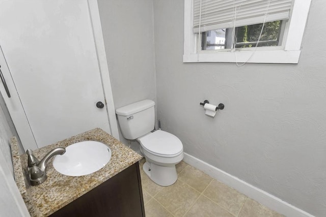 82 Grove St, North Brookfield, MA 01535 - half bathroom with baseboards, vanity, toilet, and tile patterned flooring