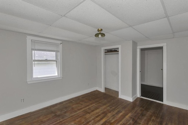 82 Grove St, North Brookfield, MA 01535 - unfurnished bedroom with a drop ceiling, wood finished floors, baseboards, and a closet