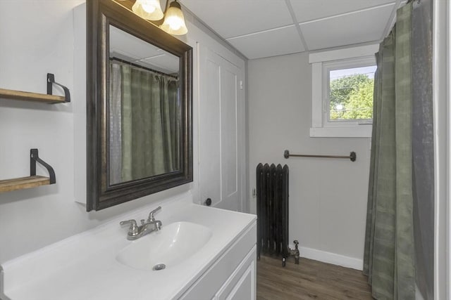 82 Grove St, North Brookfield, MA 01535 - bathroom with radiator, wood finished floors, vanity, and baseboards