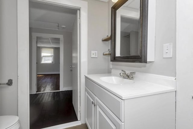 82 Grove St, North Brookfield, MA 01535 - half bath featuring vanity, wood-type flooring, and toilet