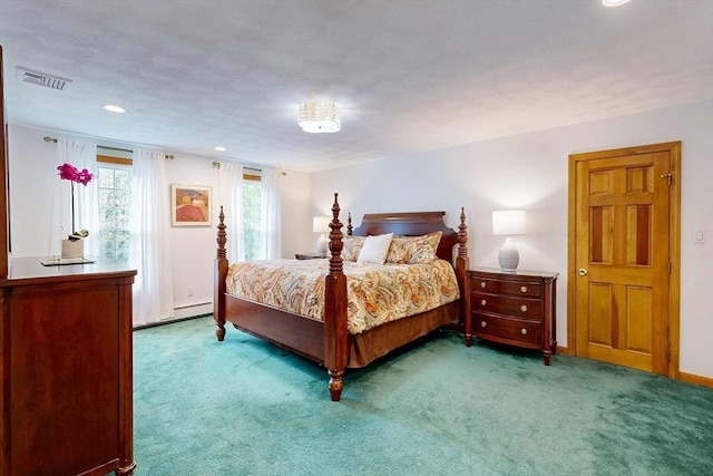 bedroom with carpet flooring, a baseboard heating unit, recessed lighting, and baseboards
