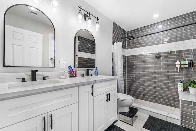 105 Depot St Unit A, Milford, MA 01757 - full bathroom featuring tiled shower, toilet, double vanity, and tile patterned flooring