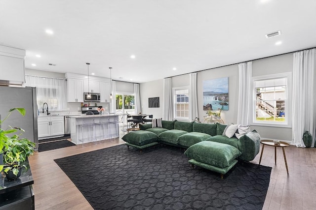 105 Depot St Unit A, Milford, MA 01757 - living area featuring dark wood-style flooring and recessed lighting