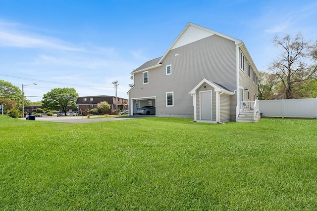 105 Depot St Unit A, Milford, MA 01757 - rear view of house featuring an attached garage and driveway