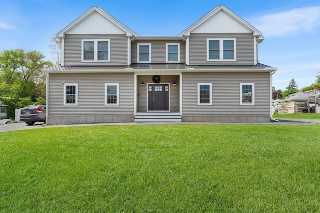 105 Depot St Unit A, Milford, MA 01757 - view of front of house with metal roof, a front lawn, and a standing seam roof