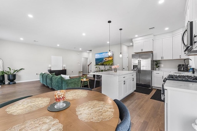 105 Depot St Unit A, Milford, MA 01757 - dining room featuring light wood-style floors, recessed lighting, stairway, and baseboards
