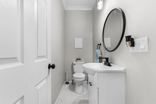 105 Depot St Unit A, Milford, MA 01757 - bathroom featuring toilet, marble finish flooring, vanity, ornamental molding, and baseboards