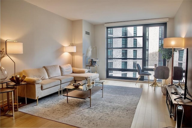 living room with light hardwood / wood-style floors