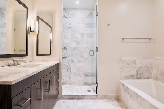 bathroom with separate shower and tub and vanity