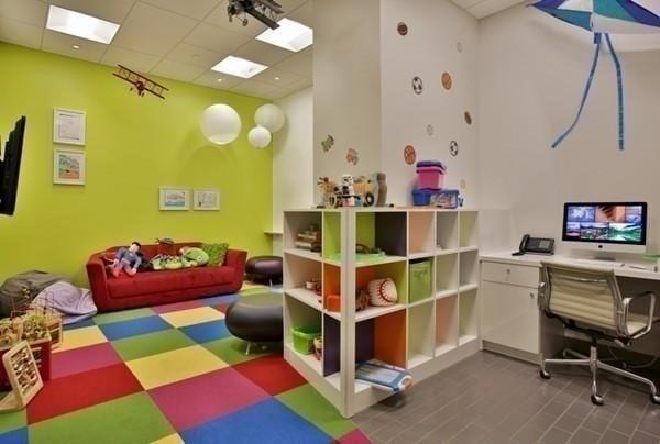 playroom with a paneled ceiling