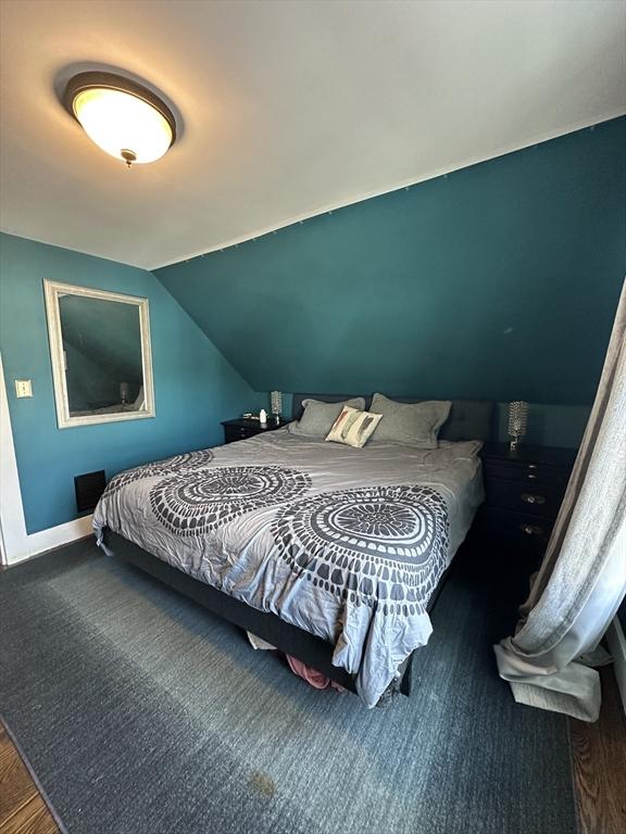 bedroom featuring lofted ceiling